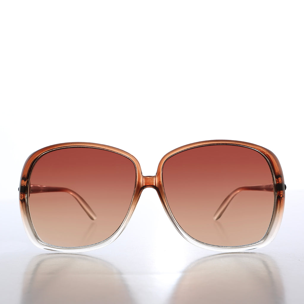 Brown sunglasses with a gradient lens on a white background