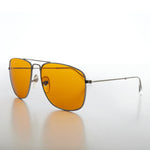 Load image into Gallery viewer, Sunglasses with yellow lenses and metal frame on a white background
