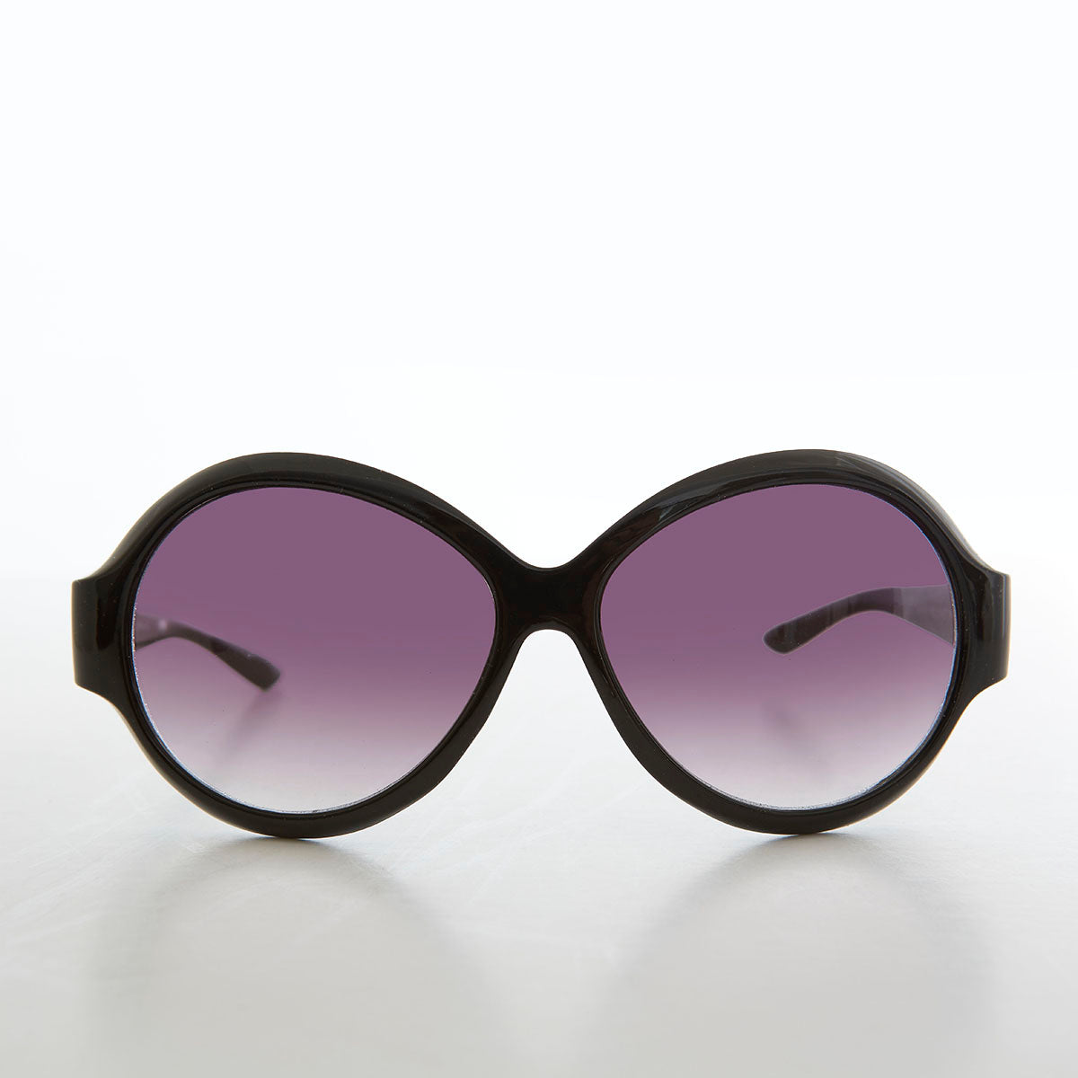 round oversized black women's sunglasses with gradient lenses
