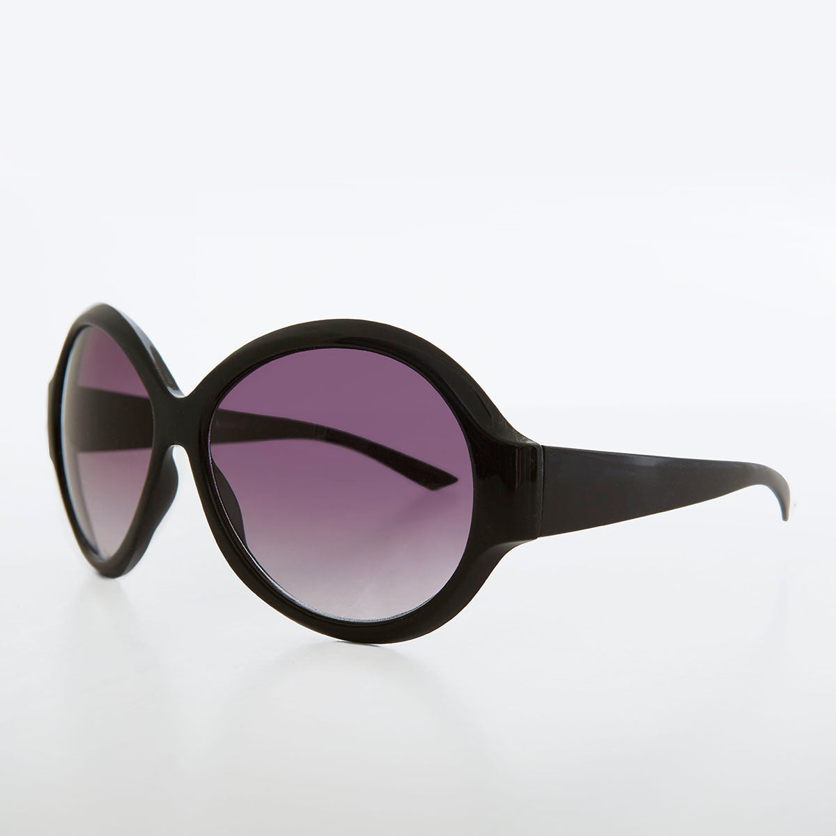 round oversized black women's sunglasses with gradient lenses
