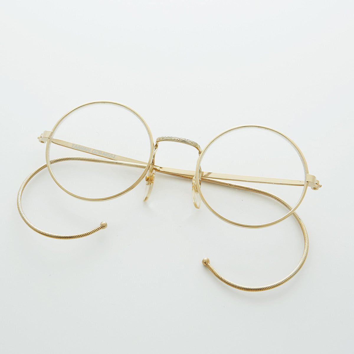round clear lens vintage glasses with cable temples